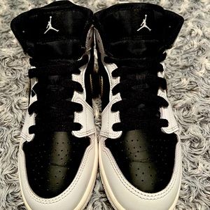 White Gold and Black Air Jordan’s kids Size 2.5